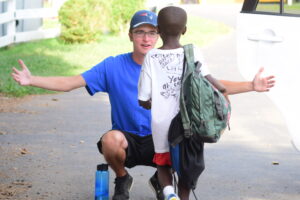 Young camper and councilor - expert staff, proven protocols, and a caring culture at Liberty Lake Day Camp